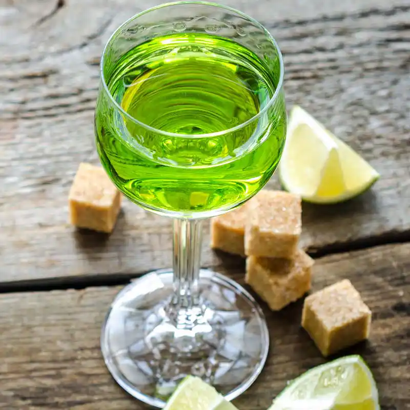 Absinthe with brown sugar and lime