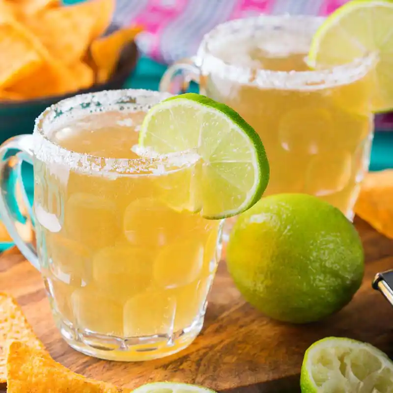Chelada beer cocktails in a mug with a lime