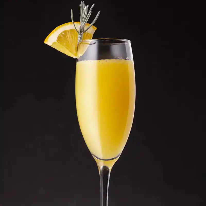 A champagne mimosa with orange and rosemary