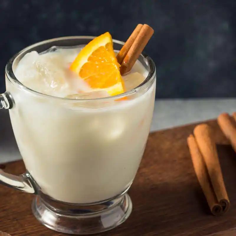Cream based cocktail with orange and cinnamon